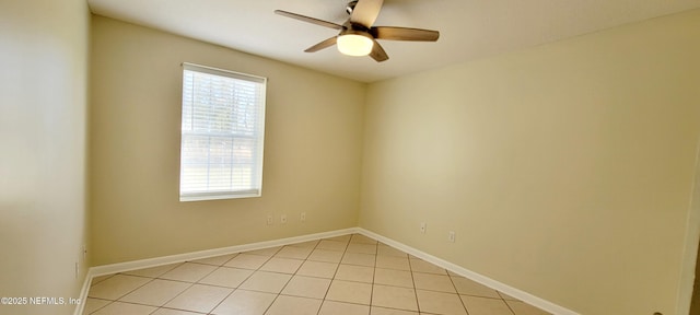 unfurnished room featuring light tile patterned floors, baseboards, and ceiling fan