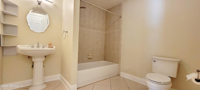 full bathroom with baseboards, toilet, washtub / shower combination, and tile patterned flooring