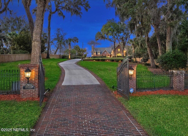 view of home's community featuring a fenced front yard and a yard