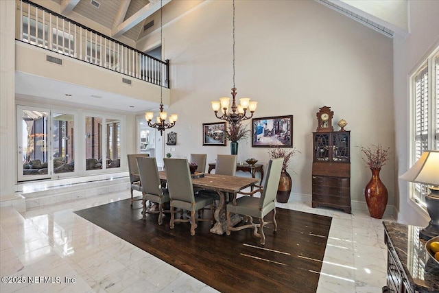 dining area with baseboards, visible vents, marble finish floor, high vaulted ceiling, and a notable chandelier