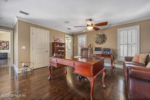 office area with visible vents, dark wood-type flooring, ornamental molding, a ceiling fan, and baseboards