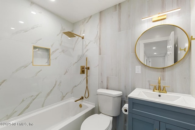 bathroom with washtub / shower combination, tile walls, vanity, and toilet