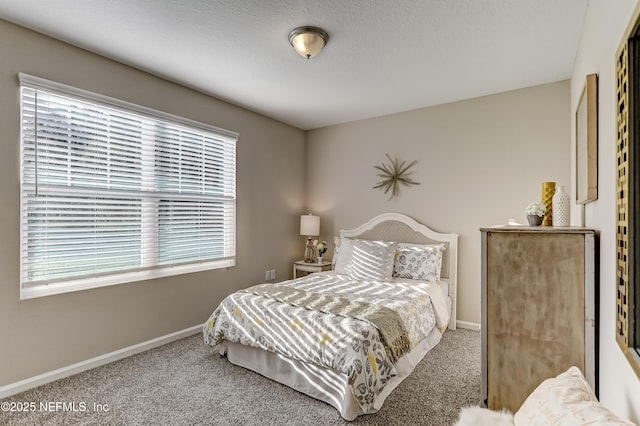 carpeted bedroom with baseboards