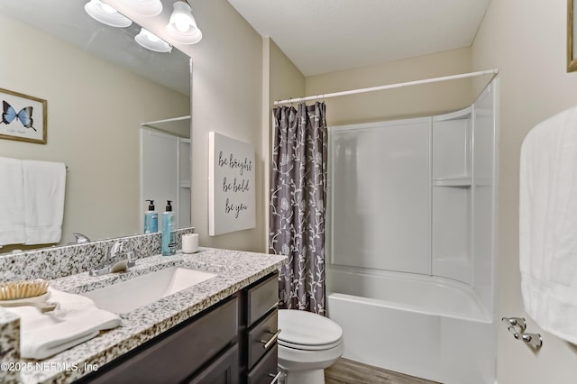 full bath featuring toilet, wood finished floors, shower / bath combo with shower curtain, and vanity