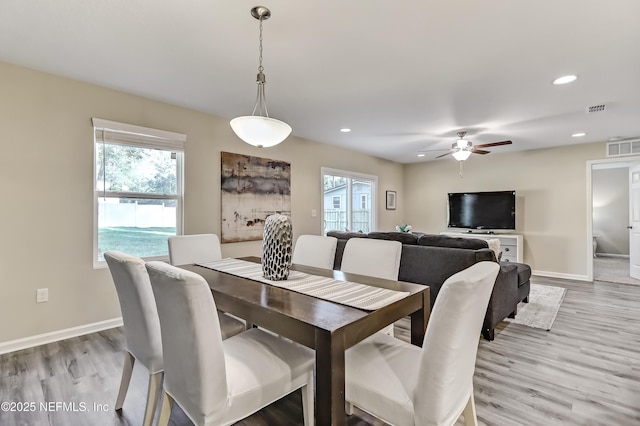 dining space featuring light wood-style floors, baseboards, visible vents, and recessed lighting