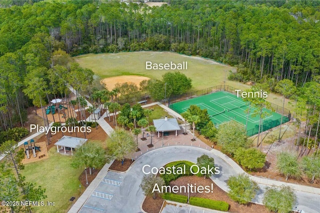 bird's eye view featuring a wooded view