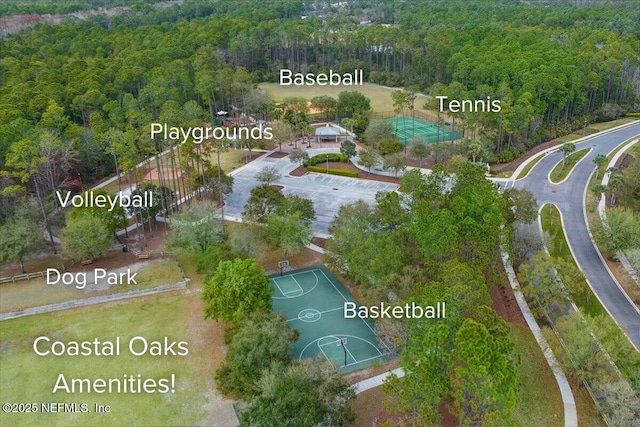 birds eye view of property featuring a view of trees