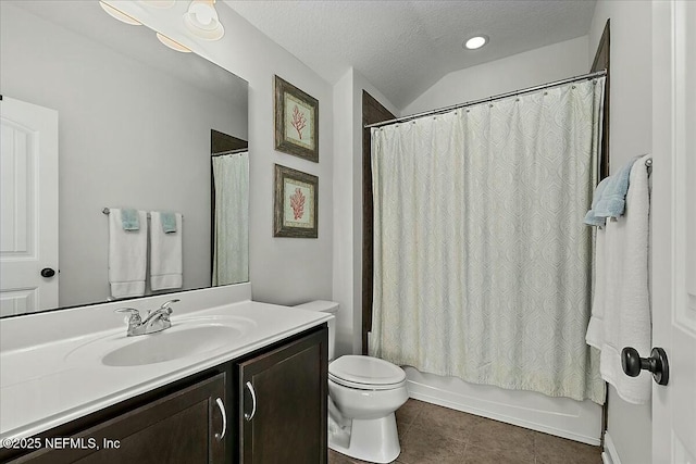 bathroom featuring a textured ceiling, toilet, vanity, tile patterned floors, and shower / bath combo