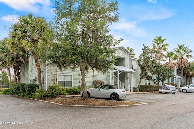 view of front of house with uncovered parking