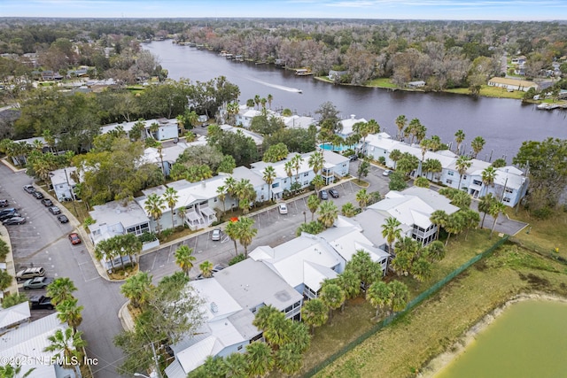 bird's eye view with a water view and a residential view