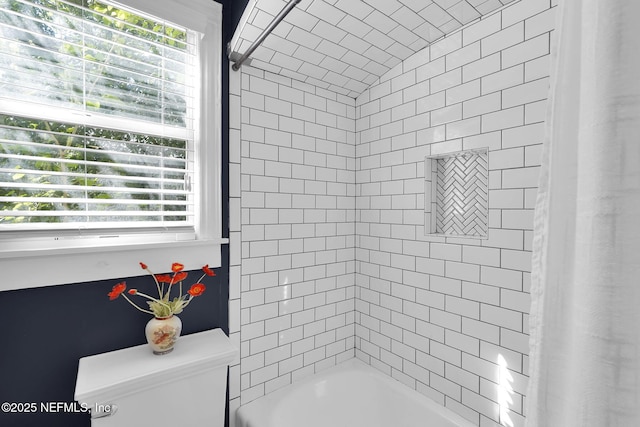 bathroom with toilet and shower / washtub combination