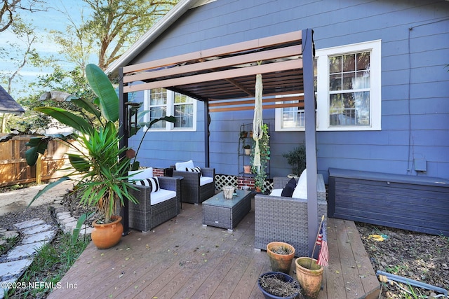 deck featuring fence and an outdoor hangout area