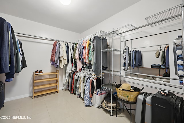 walk in closet featuring tile patterned flooring