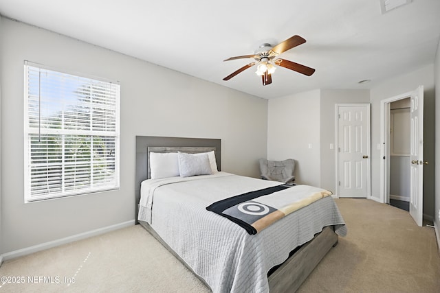 bedroom featuring carpet, visible vents, baseboards, and a ceiling fan