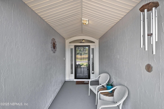 entrance to property with stucco siding