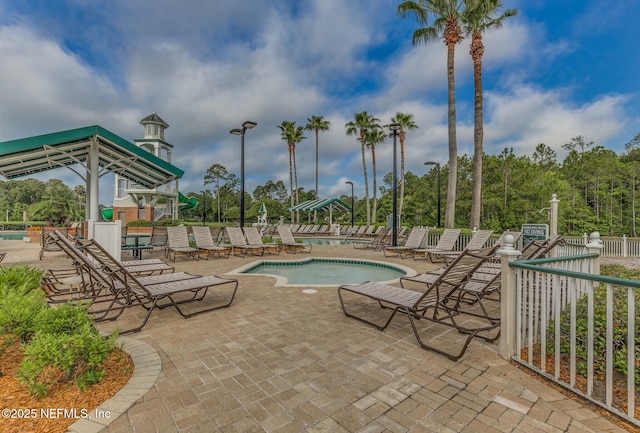 community pool featuring a patio area