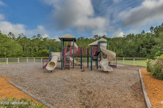 community jungle gym featuring fence