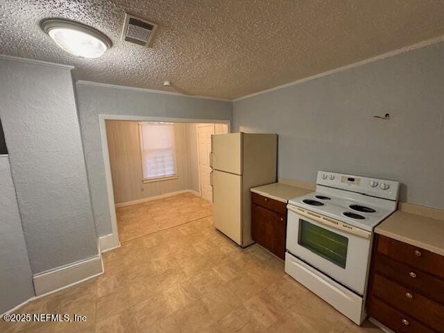 kitchen with white appliances, visible vents, light countertops, ornamental molding, and dark brown cabinets