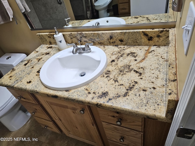 bathroom featuring vanity, toilet, and tile patterned floors