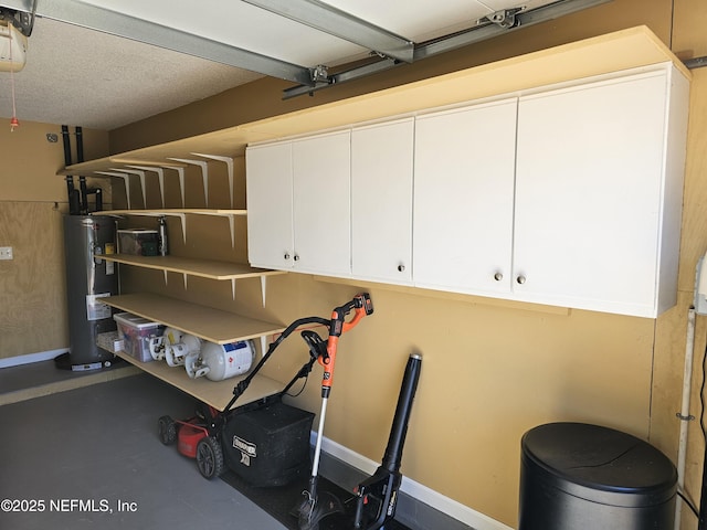 exercise room featuring a garage and water heater