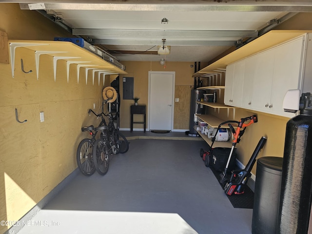 garage with water heater and electric panel