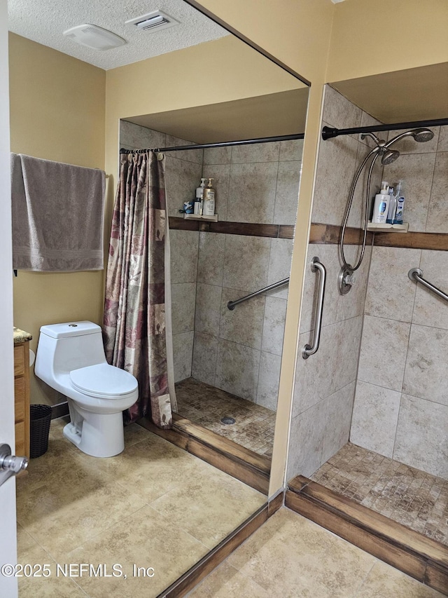 full bathroom featuring visible vents, toilet, a stall shower, a textured ceiling, and tile patterned floors