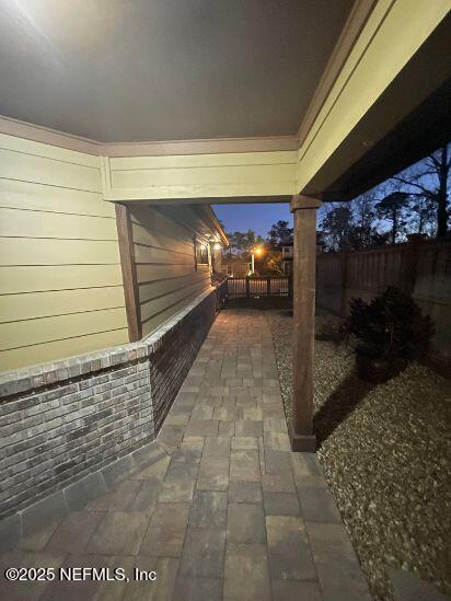 view of patio featuring fence