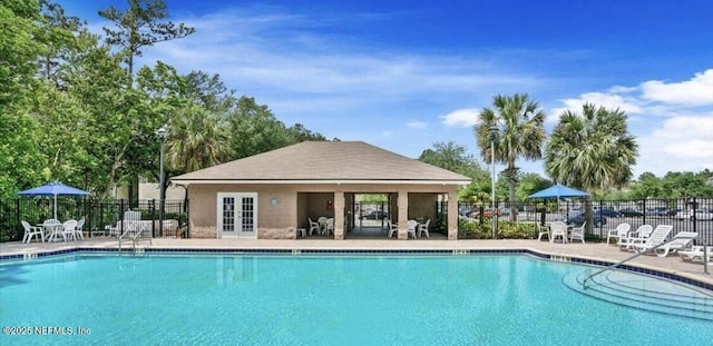 view of pool with fence