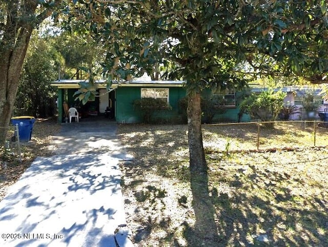 view of front of home featuring fence