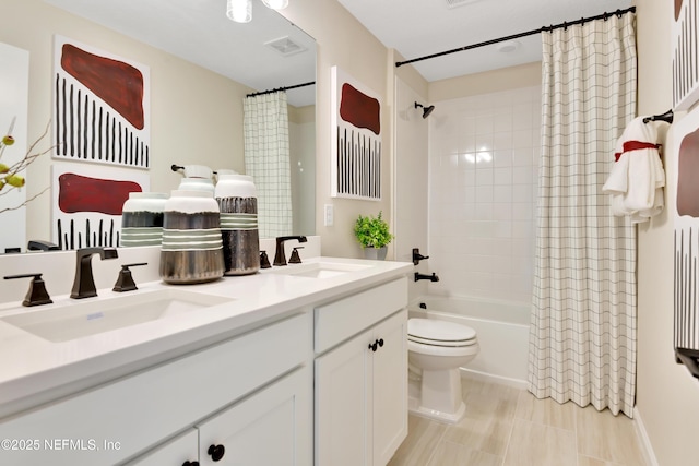 full bath with shower / bath combination with curtain, visible vents, a sink, and double vanity