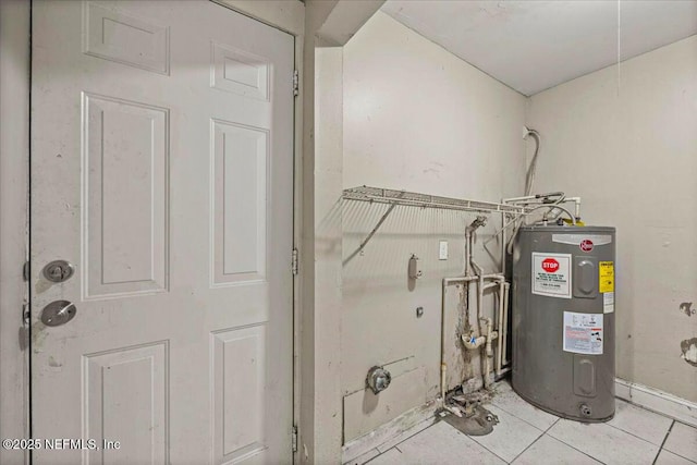 utility room featuring electric water heater