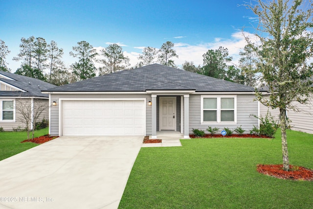 ranch-style home featuring a garage, a front yard, and driveway