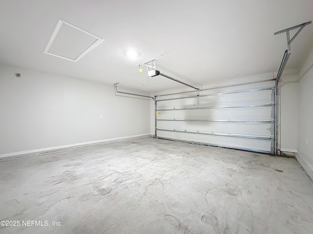 garage with baseboards and a garage door opener