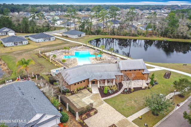 bird's eye view with a water view and a residential view