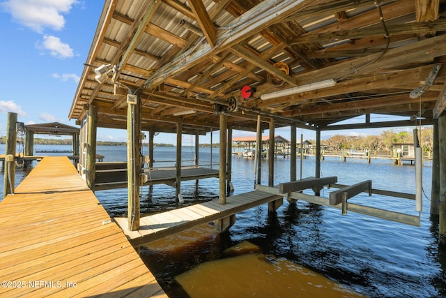 dock area featuring a water view and boat lift