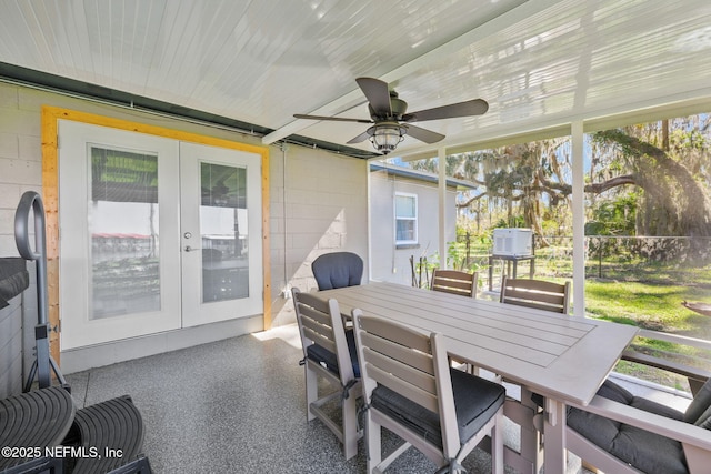 sunroom with ceiling fan and french doors