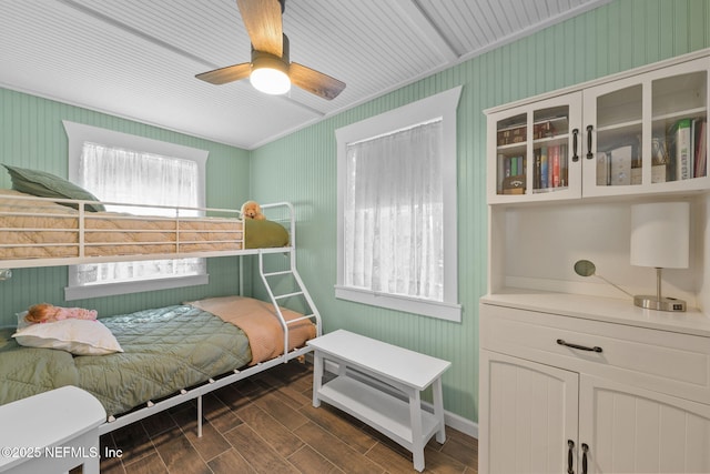 bedroom featuring ceiling fan and dark wood-type flooring