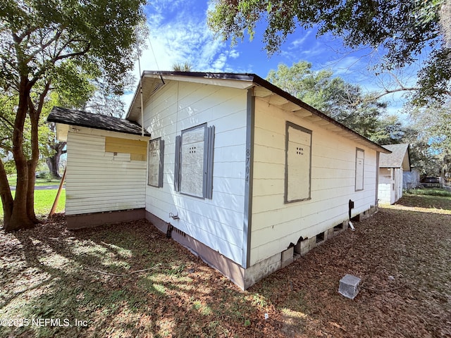 view of property exterior with crawl space