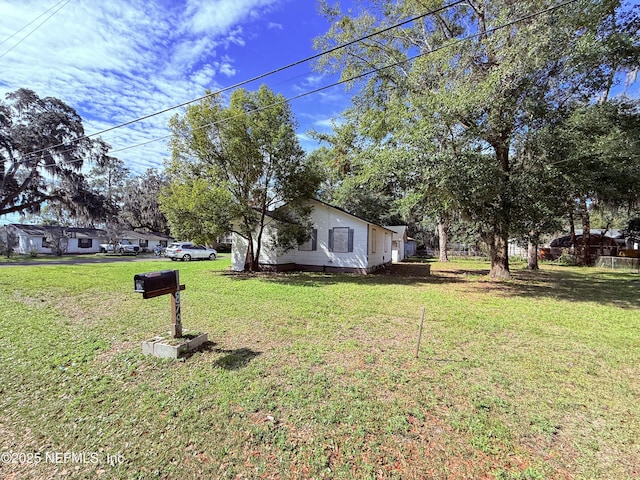 view of front of home with a front yard