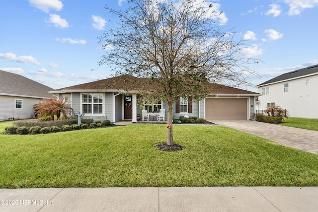 93322 Sandown Dr, Fernandina Beach, FL 32034 - ranch-style home featuring an attached garage, driveway, a front lawn, and a porch