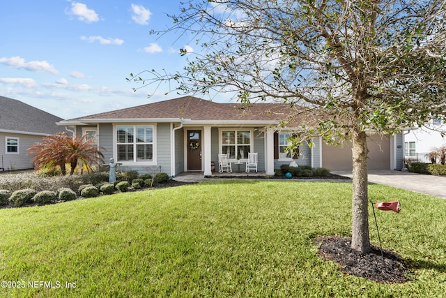 93322 Sandown Dr, Fernandina Beach, FL 32034 - ranch-style home with covered porch, concrete driveway, a garage, a front lawn, and roof with shingles
