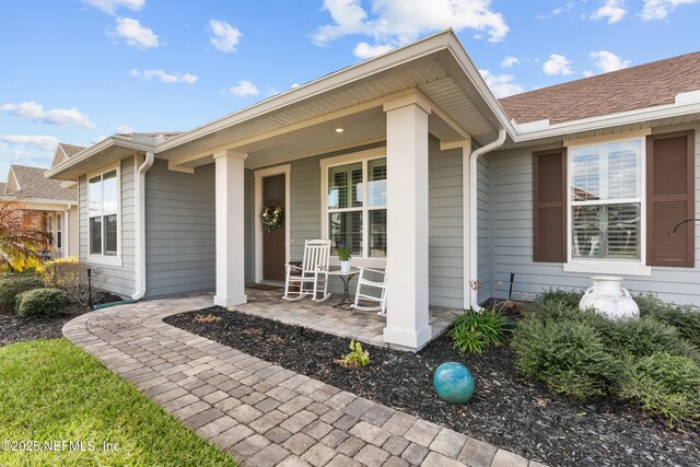93322 Sandown Dr, Fernandina Beach, FL 32034 - doorway to property with a porch and roof with shingles