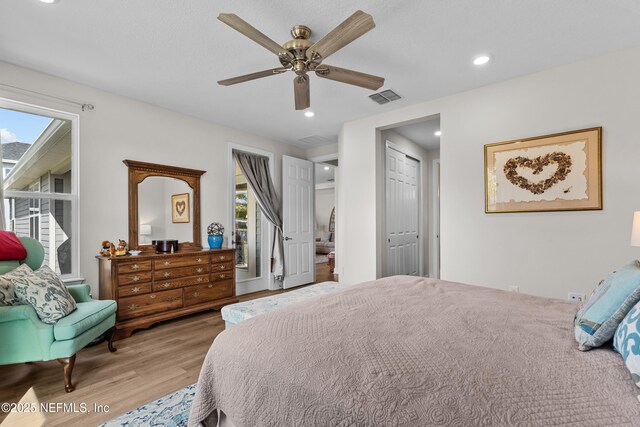 93322 Sandown Dr, Fernandina Beach, FL 32034 - bedroom featuring wood finished floors, ceiling fan, recessed lighting, and a closet