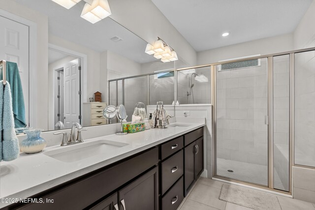 93322 Sandown Dr, Fernandina Beach, FL 32034 - full bath featuring double vanity, a stall shower, and tile patterned floors