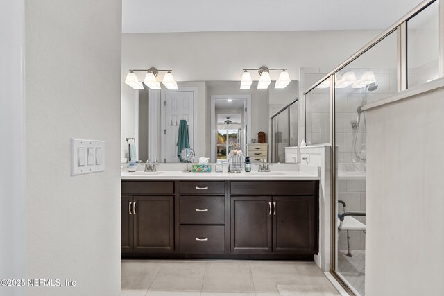 93322 Sandown Dr, Fernandina Beach, FL 32034 - bathroom with double vanity, a shower stall, and tile patterned floors