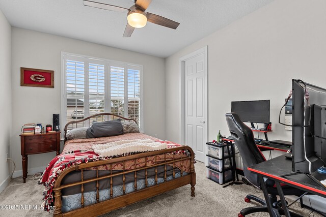 93322 Sandown Dr, Fernandina Beach, FL 32034 - carpeted bedroom featuring a desk, ceiling fan, and baseboards