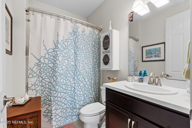 93322 Sandown Dr, Fernandina Beach, FL 32034 - bathroom with vanity, toilet, and curtained shower