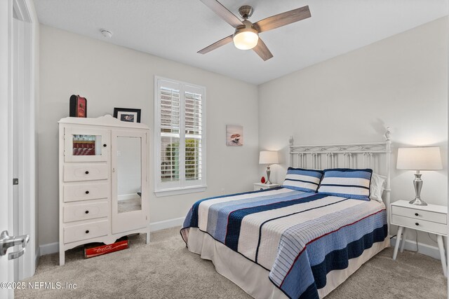 93322 Sandown Dr, Fernandina Beach, FL 32034 - carpeted bedroom featuring baseboards and a ceiling fan