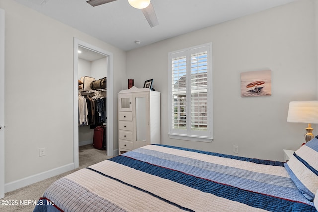 93322 Sandown Dr, Fernandina Beach, FL 32034 - bedroom with carpet floors, baseboards, a walk in closet, a closet, and a ceiling fan