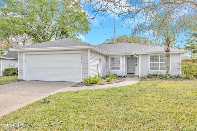 single story home featuring a front lawn, an attached garage, driveway, and roof with shingles